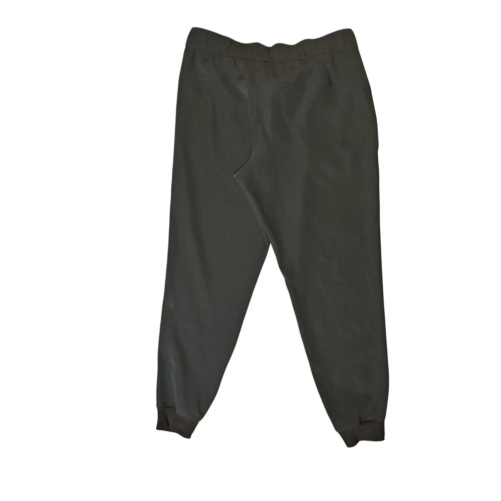 Lululemon On the Fly Jogger Women 10 Green Woven Tapered Pant Drawstring Pocket